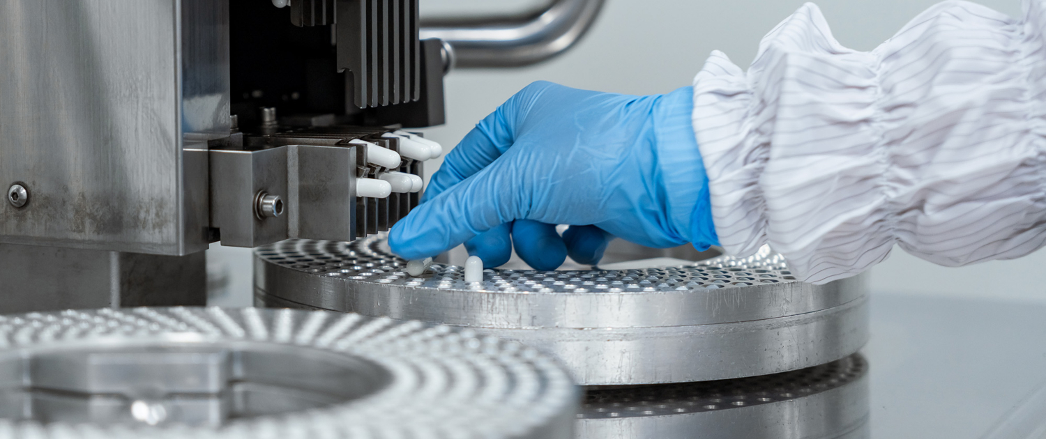 Glove Of Medical Professional Working With Machinery
